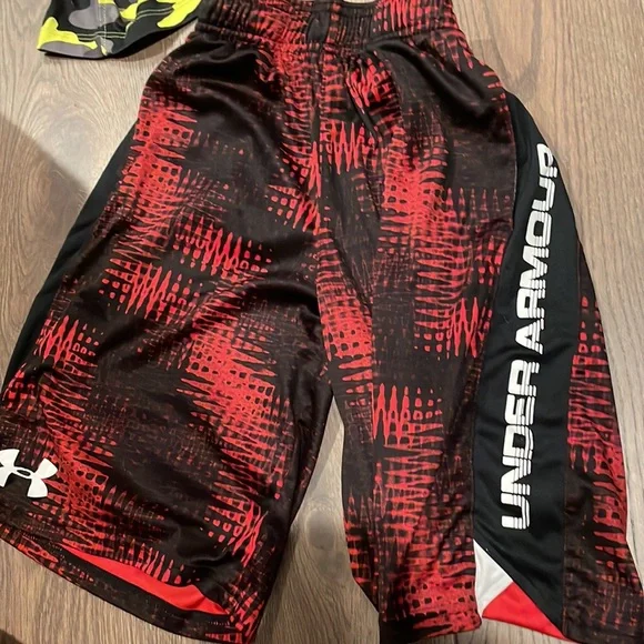 two basketball shorts both red are mediums and camp is large - Picture 2 of 4